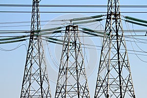 High-voltage power lines at sunset. electricity distribution station. high voltage electric transmission tower.