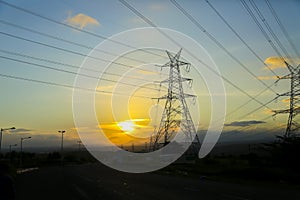 High-voltage power lines at sunset,high voltage electric transmission tower