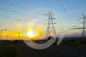 High-voltage power lines at sunset,high voltage electric transmission tower