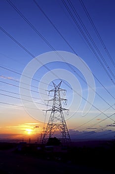 High-voltage power lines at sunset,high voltage electric transmission tower