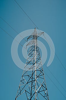 High Voltage Power Pole Line Clear Blue Sky