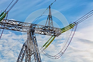 High voltage power pylon on nice blue sky with clouds