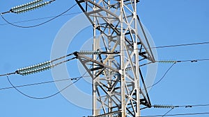 A high voltage power pylons against blue sky