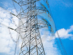 A high voltage power pylons against blue sky