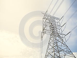 A high voltage power pylons against blue sky