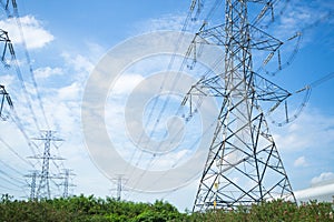 A high voltage power pylons against blue sky