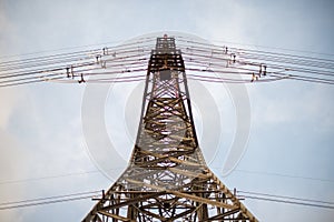 High-Voltage Power Tower from Ground Perspective