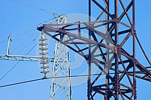 High-voltage power, towers, wires and insulators close-up