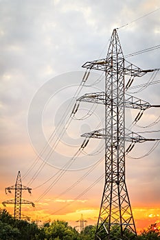 High voltage power transmission towers with electrical energy wi