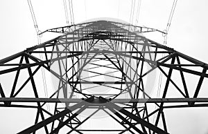 High-voltage power transmission towers in polluted gray sky on Nov 1, 2014