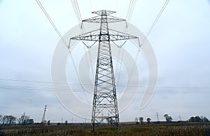 High-voltage power transmission towers in polluted gray sky on Nov 1, 2014