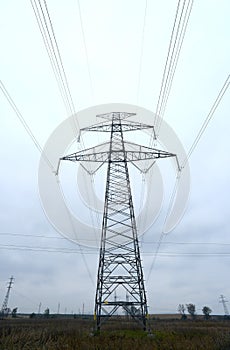 High-voltage power transmission towers in polluted gray sky on Nov 1, 2014