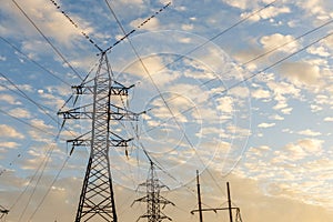 High voltage pylon with birds sitting on it