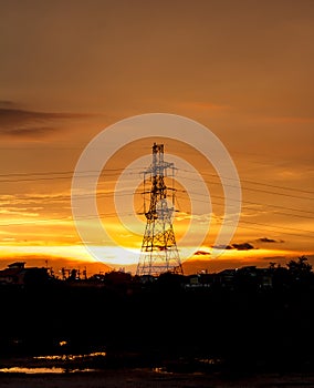 High voltage pylons on the evening sunset, silhouette