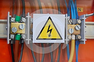 High voltage sign. Electrical relays and wires.