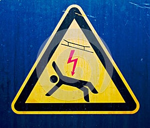 High voltage sign on old metal surface