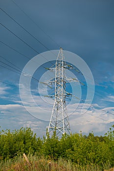High-voltage support against a stormy sky