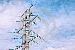 High-voltage tower on a blue sky