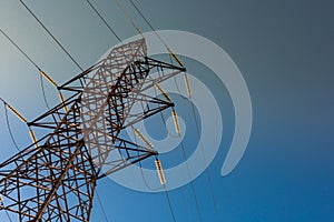 High voltage tower with blue sky background