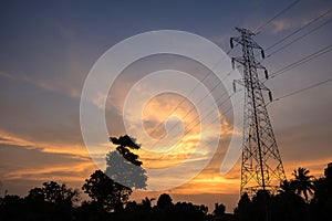 High voltage tower electric pole on twilight sky