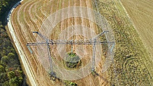 High voltage tower with electric power lines transfening electrical energy through cable wires