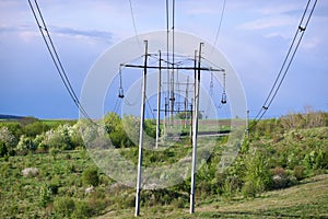 High voltage tower with electric power lines transfening electrical energy through cable wires