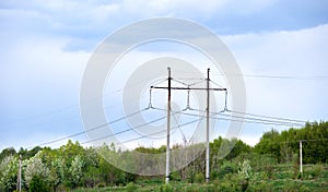 High voltage tower with electric power lines transfening electrical energy through cable wires