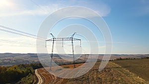 High voltage tower with electric power lines transfening electrical energy through cable wires