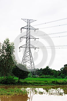 High voltage tower. Electricity post. Electric post. High voltage lines and power pylons in rice field