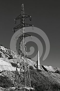 High voltage tower in an old abandoned quarry