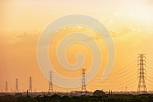 High voltage tower with sky at sunset background