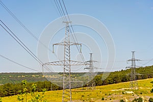 High voltage towers Electric pole. Power line support with wires for electricity transmission. High voltage grid tower