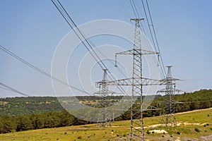 High voltage towers Electric pole. Power line support with wires for electricity transmission. High voltage grid tower