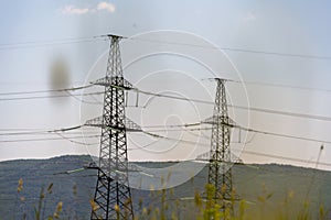 High voltage towers Electric pole. Power line support with wires for electricity transmission. High voltage grid tower