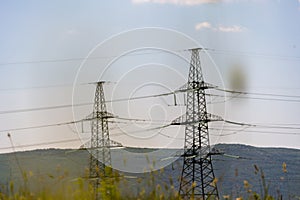 High voltage towers Electric pole. Power line support with wires for electricity transmission. High voltage grid tower