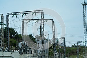 High voltage towers with sky background. Power line support with wires for electricity transmission. High voltage grid