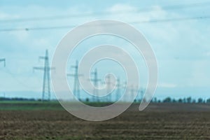 High voltage towers with sky background. Power line support with wires for electricity transmission. High voltage grid