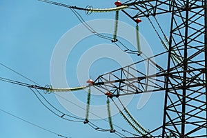 High voltage towers with sky background. Power line support with wires for electricity transmission. High voltage grid