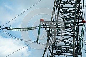 High voltage towers with sky background. Power line support with wires for electricity transmission. High voltage grid