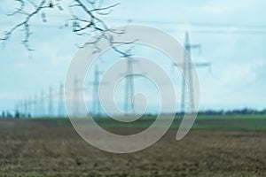 High voltage towers with sky background. Power line support with wires for electricity transmission. High voltage grid