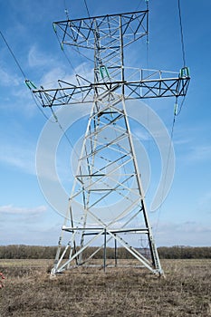 High voltage towers, under the blue sky white clouds