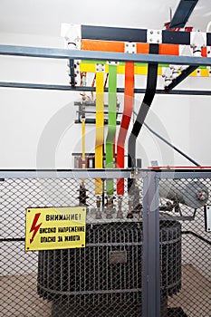 High voltage transformator with warning sign