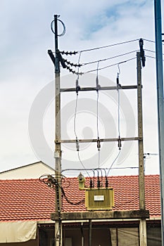 High voltage transformer on the electric poles with electrical insulation and electrical equipment in power substation