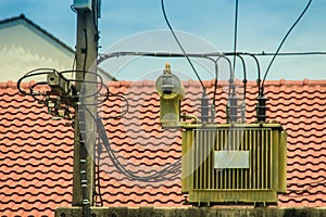 High voltage transformer on the electric poles with electrical insulation and electrical equipment in power substation