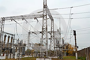 High voltage transformer at an electrical substation of the city power grid. Power wires with high voltage