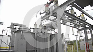 High voltage transformer equipment at the electrical power substation. High-voltage circuit breaker. High voltage switch