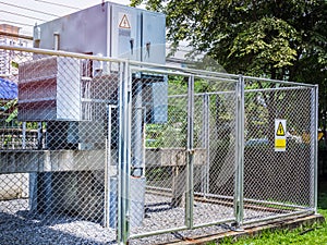 High voltage transformer substation in fence