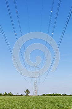 High voltage transmission line against clear blue sky