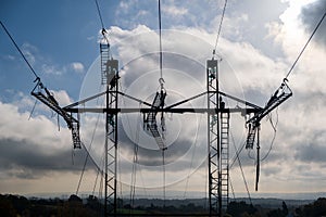 High voltage transmission tower, power line modernization, high-rise work on the power transmission line