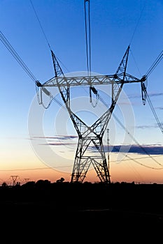 High voltage Transmission towers at the sunset